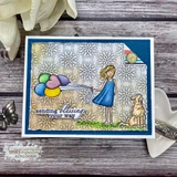 Sample card: the girl in a blue dress with pastel balloons and a golden dog over a stamped flower background, framed in navy