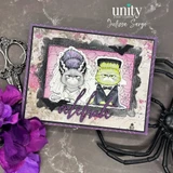 Purple-framed Halloween card on pink spiderweb paper with a bride cat in a tall streaked beehive and a green groom cat in a black tuxedo, finished with a purple script word reading Celebrate.