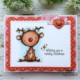 Red scalloped card on white wood with snowy pine, the twinkle lights character stamped and colored inside a white stitched panel over a soft blue sky, with a small heart and "Wishing you a twinkly Christmas."
