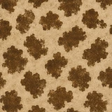 Christmas on the Range patterned paper - brown cowhide spots on a cream background.