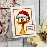 White card layered on kraft and cream with the big-eyed furry weirdo in a red Santa hat, colored in warm golds, stamped 'Deck the halls with weirdness.'