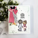 Card with the couple coloured in grey and pink beside layered pink and black patterned dresses and heart die cuts, sentiment "May every season bring you closer."