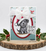 Handmade card made with Unity Stamp Co's Odie's Holiday Home red rubber stamp set: Odie in a Santa hat inside a red oval frame with a white bow and the "Home is the best gift of all." sentiment.