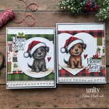 Two Christmas cards side by side: a gray Odie puppy in a red Santa hat in a circle frame on green plaid, and a brown Odie in a heart frame on red buffalo plaid, each with 'Home is the best gift of all.'