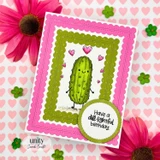 Pink scalloped frame card on a heart background: the green pickle with pink hearts inside a lime scalloped frame, and a circle sentiment 'Have a dill-ightful birthday.'