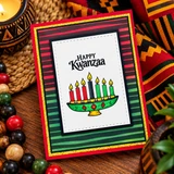 Celebrations of Light card from Unity Stamp Co: the Kwanzaa kinara with red, black and green candles in a green holder on red and green striped panels with gold glitter, with "Happy Kwanzaa".