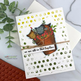 Card with a cozy stacked-animals image over a gold distressed-dot background.