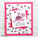 Card with a pink turtle on a heart-print background, 'Wishing you a speedy recovery.'