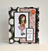 Card with the girl colored in a green top and pink skirt on a black and white polka dot and floral layout, with 'i will give you my heart' on a small panel.