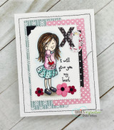 Card with the girl in a pink top and teal polka dot skirt beside 'i will give you my heart', with a black XO, pink hearts paper and felt flowers.