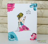 White floral card with the praying girl in pink, 'I am praying for you.'