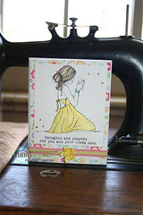 Small card with the praying girl in a yellow dress on a sewing machine, 'thoughts and prayers.'