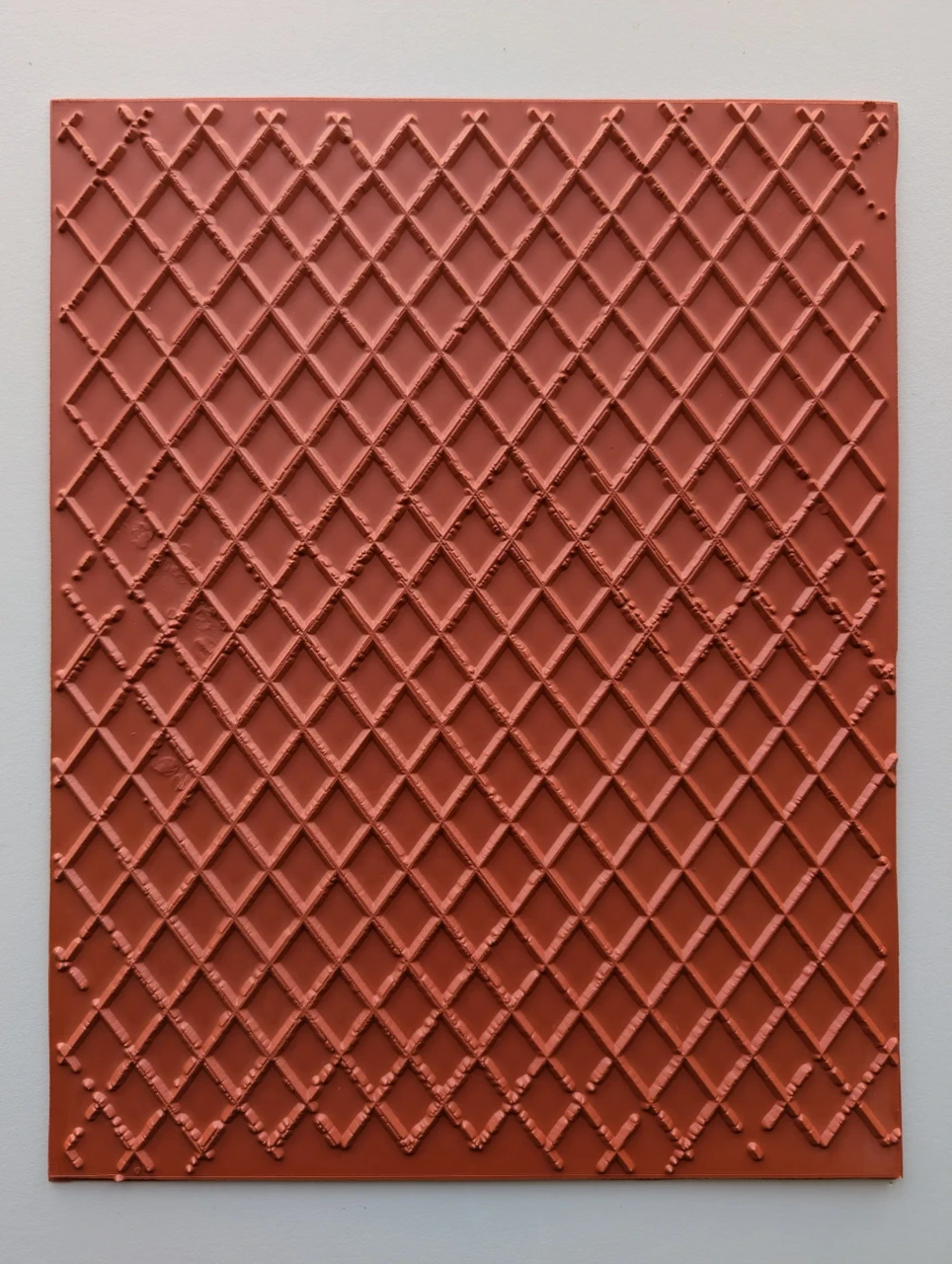 Full red rubber pottery texture mat with an irregular repeating diamond lattice.