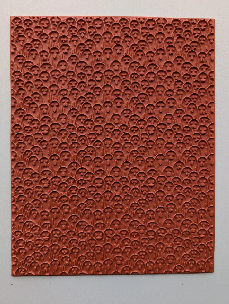 Full 10 × 12 red rubber Friendly Ghosts texture mat with rows of small ghost faces in varied expressions.