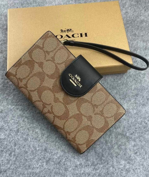 Tan and black C wristlet 