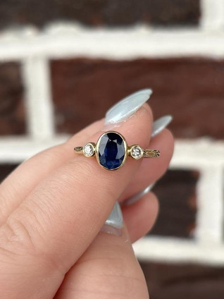 Bezel Set Oval Sapphire Ring with Round Diamond Accent Stones- 14KY