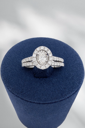0.70cttw Oval with Diamond Halo Bridal Set- 14KW