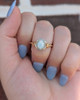 .08cttw Opal and Diamond Halo Twist Ring- 10KY