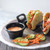 TableCraft Products RAM2BK 2 Oz. Melamine Black Plain Ramekin - 12/Case