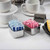 TableCraft Products 58MF 3 1/2" x 2 3/4" x 1 3/4" Stainless Steel Sugar Packet Rack With Mirror Finish - 12/Case