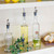 TableCraft Products 10379 17 1/2 Oz. Clear Glass With Stainless Steel Pourer Oil & Vinegar Bottle