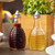 TableCraft Products BH3 6 Oz. Clear Glass Beehive Collection Oil Or Vinegar Dispensers With Stainless Steel Tops