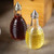 TableCraft Products BH3 6 Oz. Clear Glass Beehive Collection Oil Or Vinegar Dispensers With Stainless Steel Tops