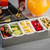 TableCraft Products 1605 15" W x 5 3/4" D x 3 1/2" H 1 Pint 5 Compartment Holder Stainless Steel With Acrylic Lid Condiment Holder
