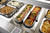 TableCraft Products 123506 18 1/2" x 5 1/4" x 4" D 4 1/2 Qt. Half Long Size With Handles Induction Aluminum Core Mirror Finish Tri-Ply Serving Pan