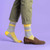 AI-generated styling image of It's OK To Fart Socks — worn, with shoes