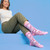 AI-generated styling image of Fuck You Unicorn Socks — on a model