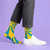 AI-generated styling image of I'm A Ray Of Fucking Sunshine Socks — worn, with shoes