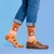 AI-generated styling image of Hold My Nuts Squirrel Socks — worn, with shoes