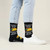 AI-generated styling image of Tacos Fall Apart Socks — worn, with shoes
