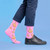 AI-generated styling image of Pink Middle Finger — worn, with shoes