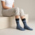 Texas Proud Steer Crew Socks | Sock Em' Sock Emporium — Seated Women