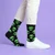 AI-generated styling image of Come In Peace Alien Socks For Men — worn, with shoes