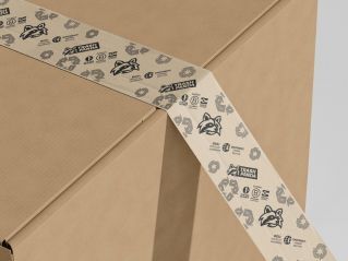 A wooden compost bin filled with dark soil stands on a lush green lawn.