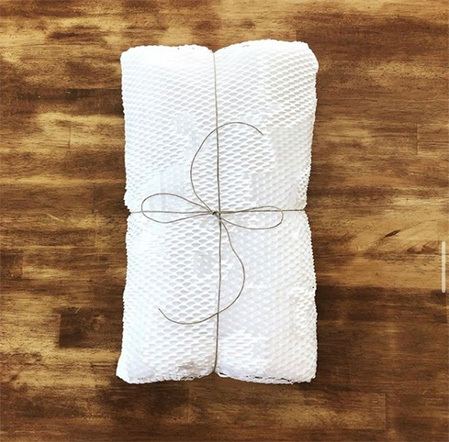 hemp string wrapped around greepwrap used for protective sustainable packaging