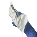 WoundStop Care 1+ Compression Trauma Dressing, Packaged held in hand