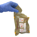 Forward Trauma Compression Dressing 4", being opened