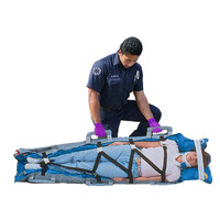 EVAC-U-SPLINT® Vacuum Mattress, in use, EMS responder with patient