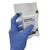 Rescue Essentials® Compressed Gauze, Z-folded- Package in hand side angle 