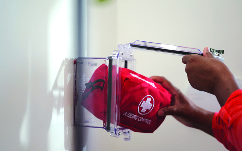 Person Taking Out A Bleeding Control Kit