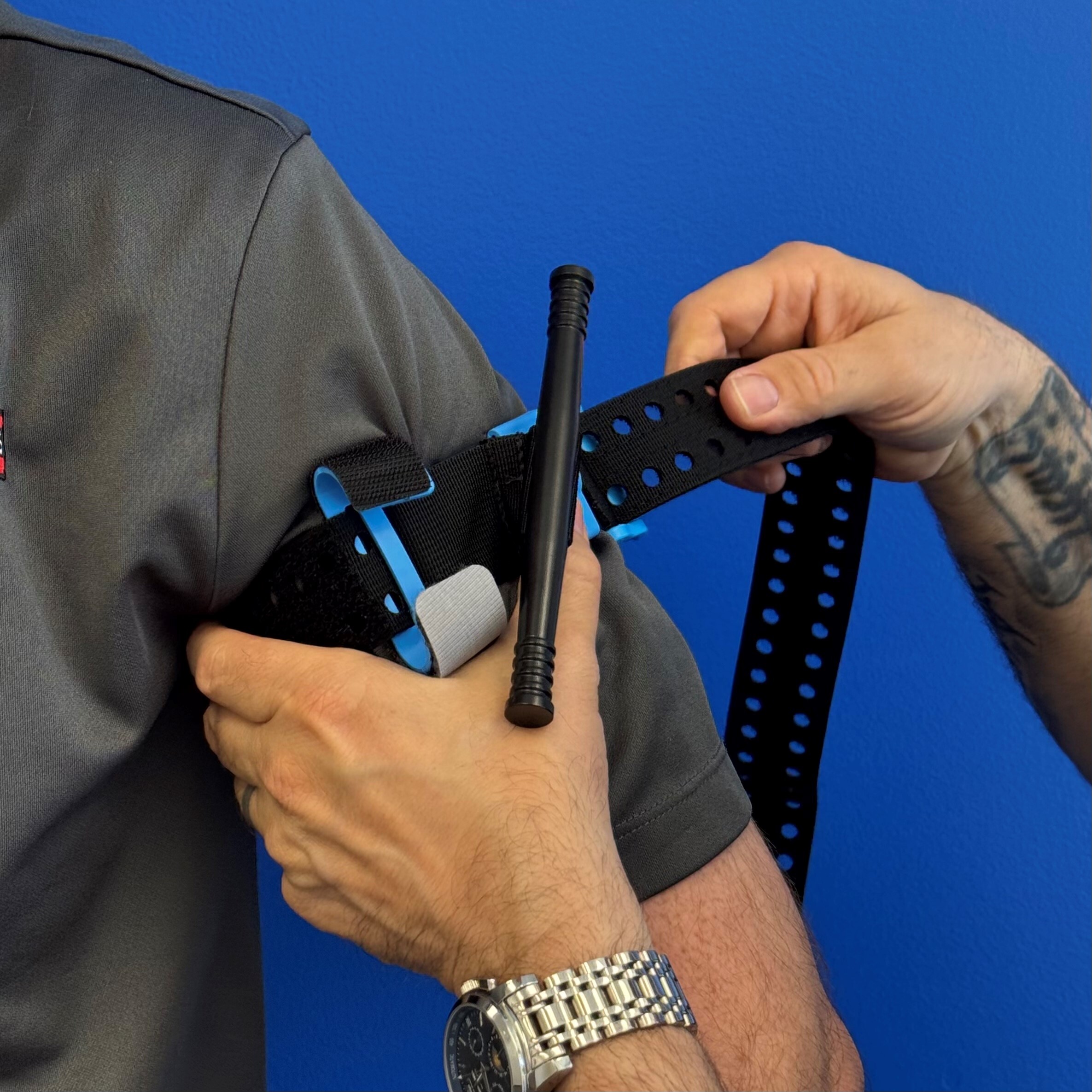 Training tourniquet being applied to arm