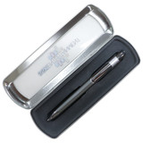 A matte metal gift box with a black pen inside, featuring a sleek design and a logo on the lid.