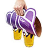 A pair of purple and yellow boxing gloves held in a hand, featuring a logo on the design.