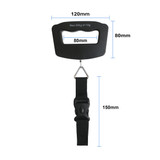 A black luggage scale with a handle, strap, and metal hook, displaying dimensions in millimetres.