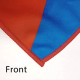 A close-up of custom polyester tea towels in vibrant red and blue with a stitched edge and a logo.