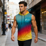 A sleeveless hoodie in blue, yellow, and red gradient with a logo, worn by a man walking down a street.